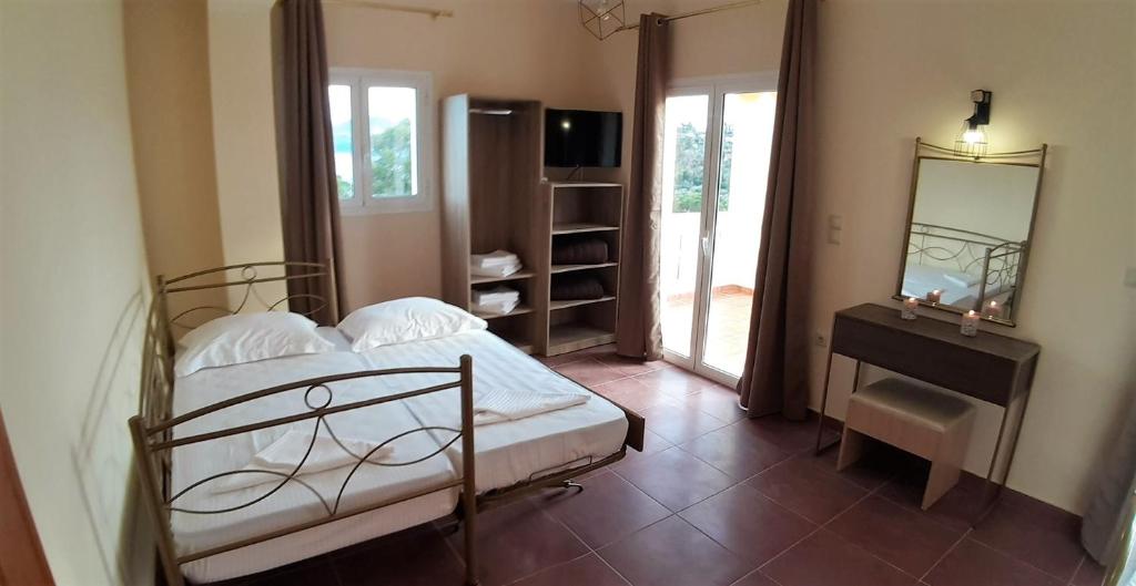 A bed or beds in a room at Villa Melody Complex