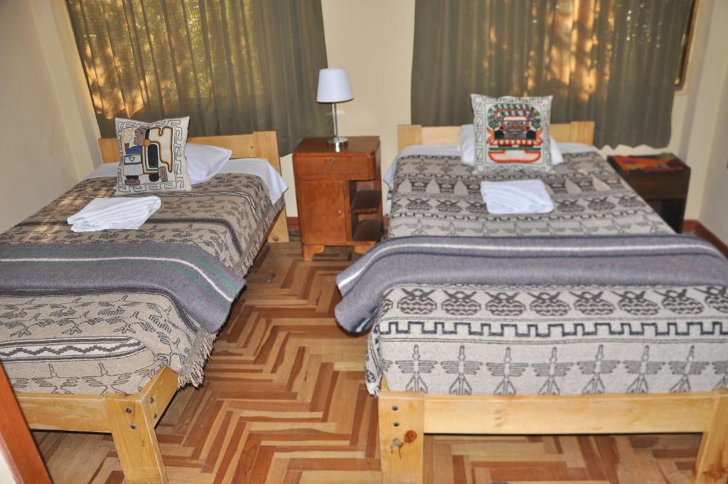 Postel nebo postele na pokoji v ubytování Hostal Goya Andina