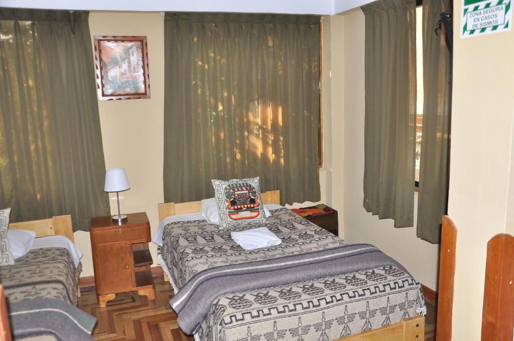 Postel nebo postele na pokoji v ubytování Hostal Goya Andina