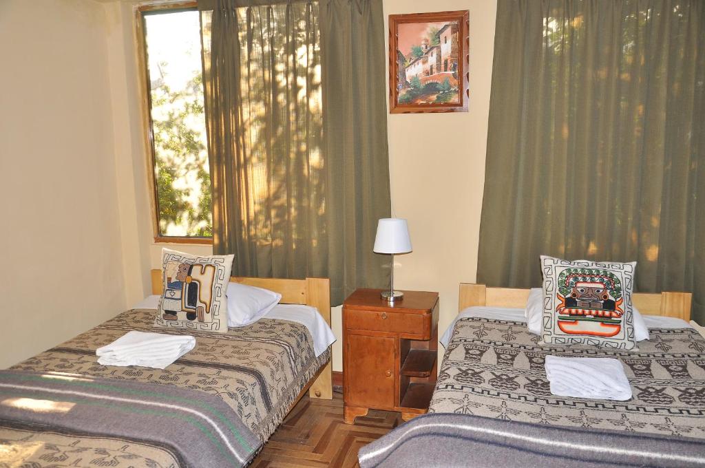 Postel nebo postele na pokoji v ubytování Hostal Goya Andina