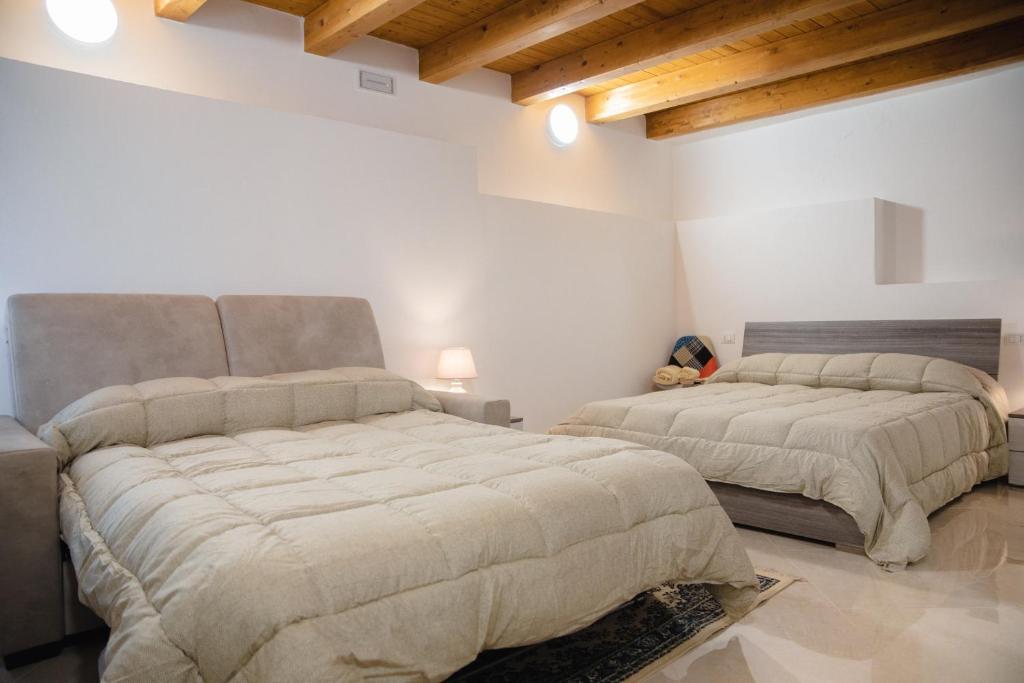 Postel nebo postele na pokoji v ubytování Le Vie di Girgenti