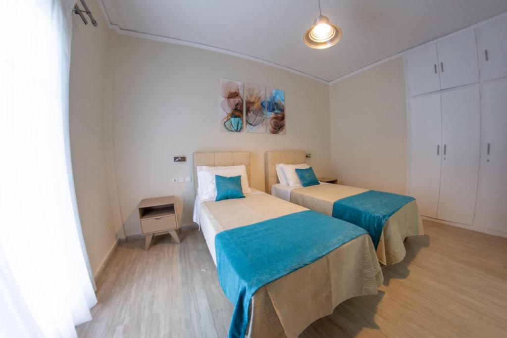 A bed or beds in a room at Eleonas Holiday Home Apartment