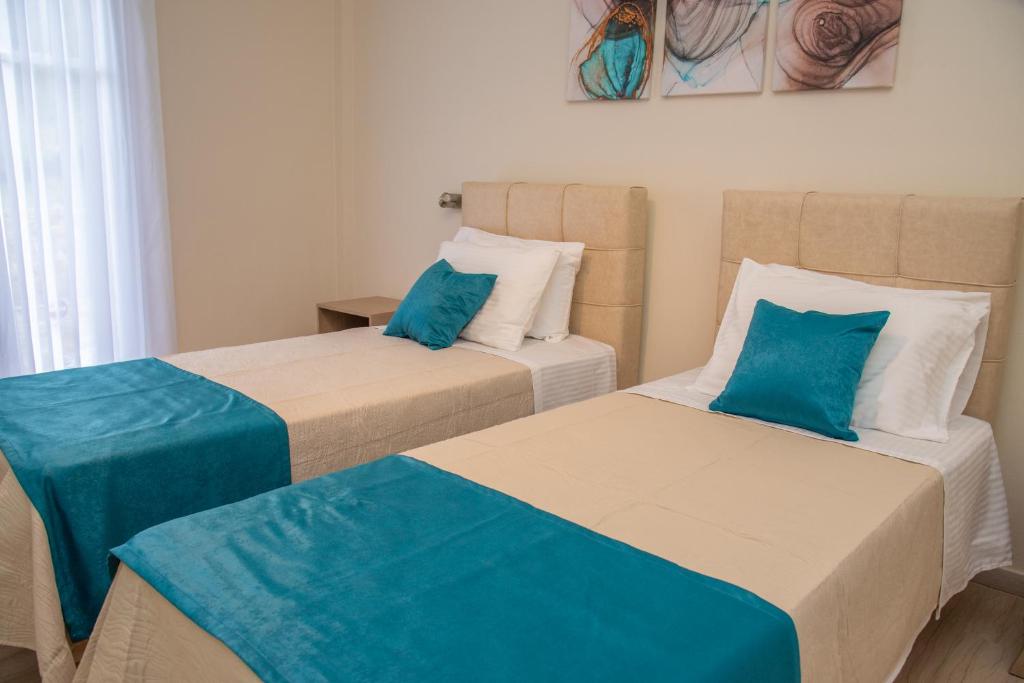 A bed or beds in a room at Eleonas Holiday Home Apartment