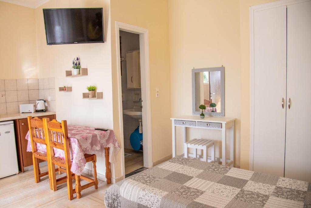 A kitchen or kitchenette at Eleonas Holiday Home Apartment