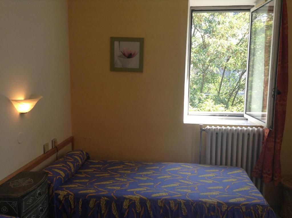 Postel nebo postele na pokoji v ubytování Hotel Acapulco