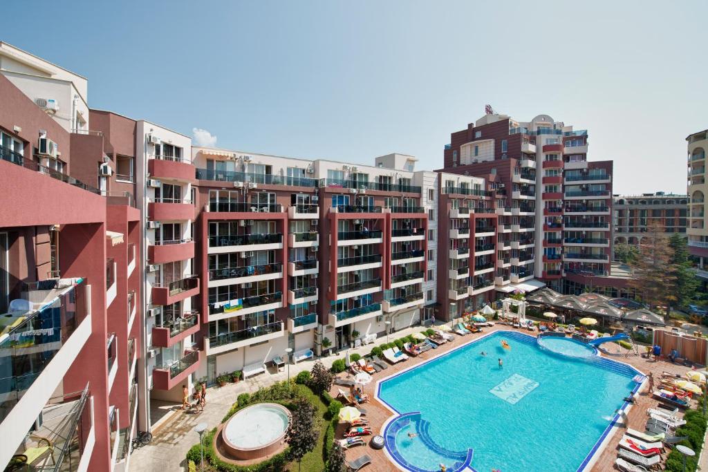 an overhead view of a swimming pool in a building at Admiral Plaza Holiday Apartments in Sunny Beach