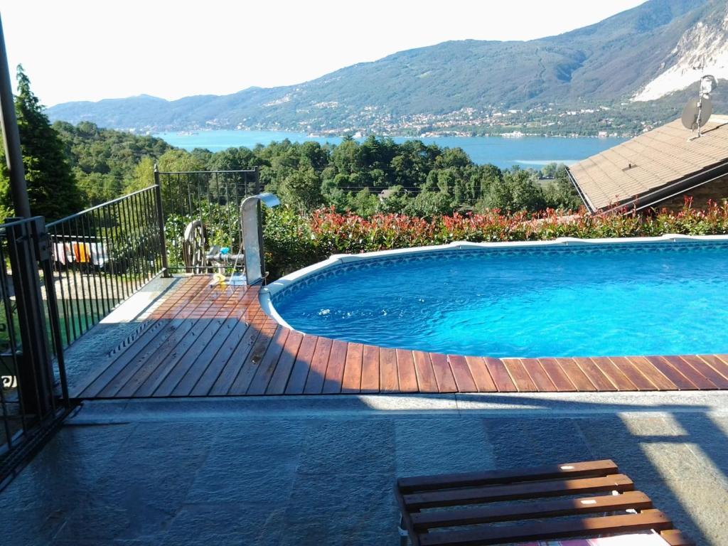 a swimming pool with a view of a lake at Casa delle Betulle in Verbania