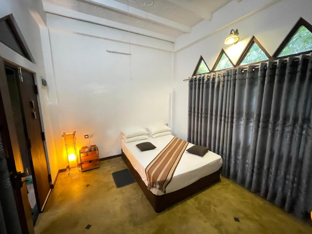 Postel nebo postele na pokoji v ubytování Hotel Gala Addara