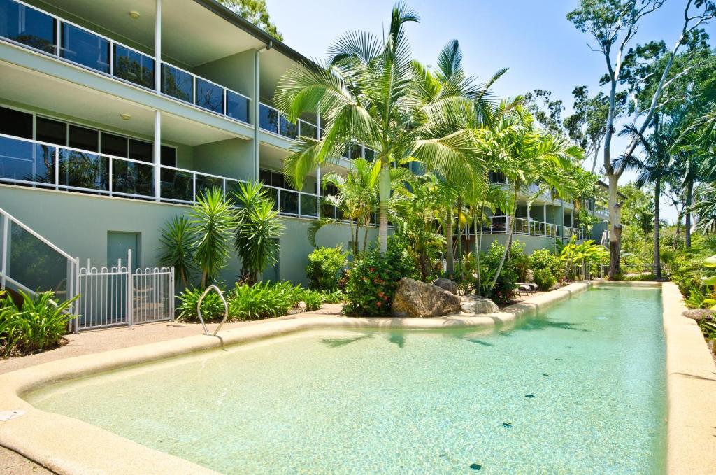 a swimming pool in front of a building at Blue Water Views on Hamilton Island by HIHA in Hamilton Island