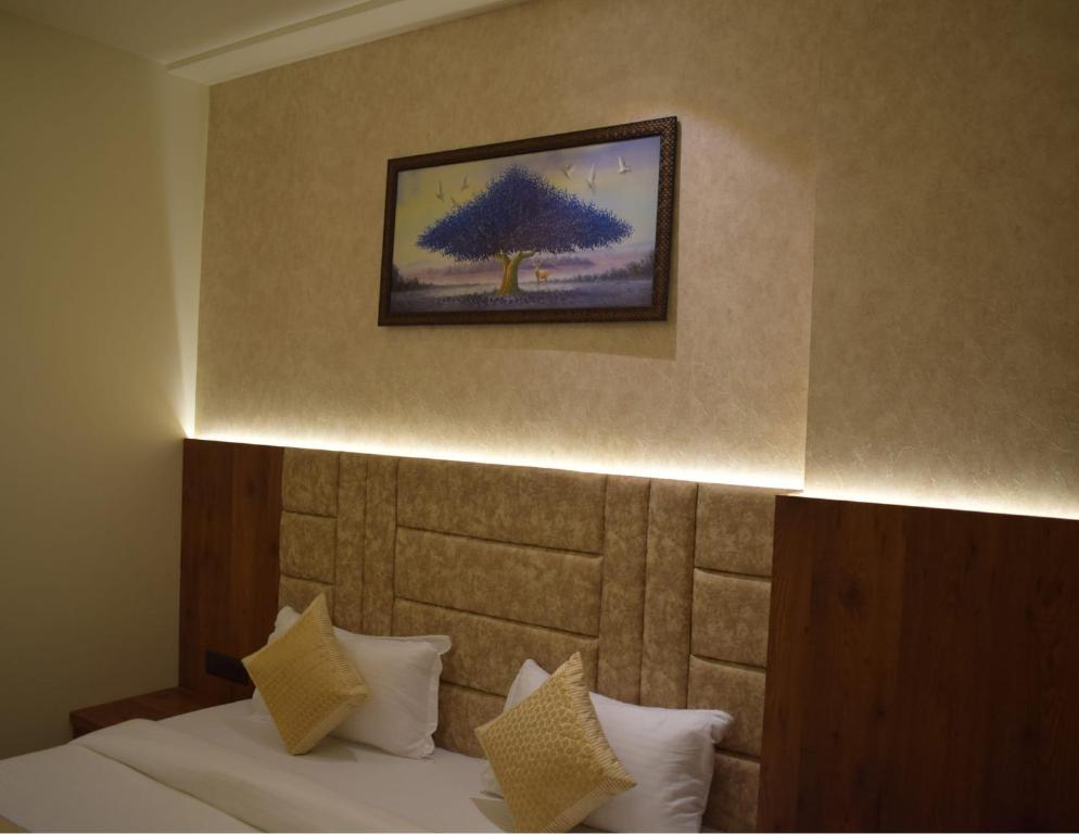 Postel nebo postele na pokoji v ubytování THE TAJ PEARL HOTEL