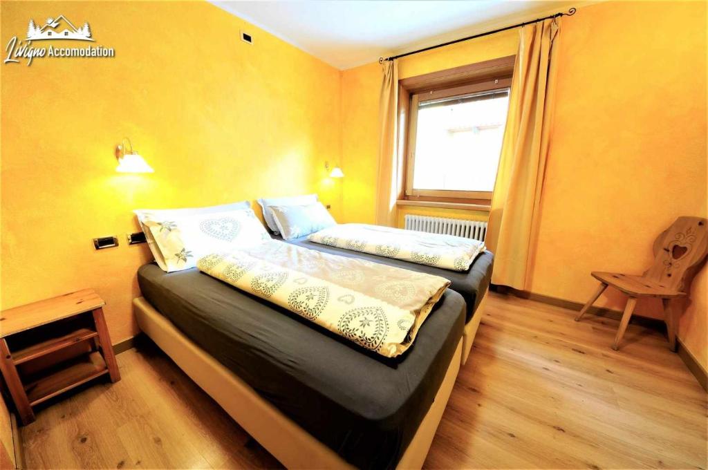 Posteľ alebo postele v izbe v ubytovaní Alpen Royal by Livigno Accomodation