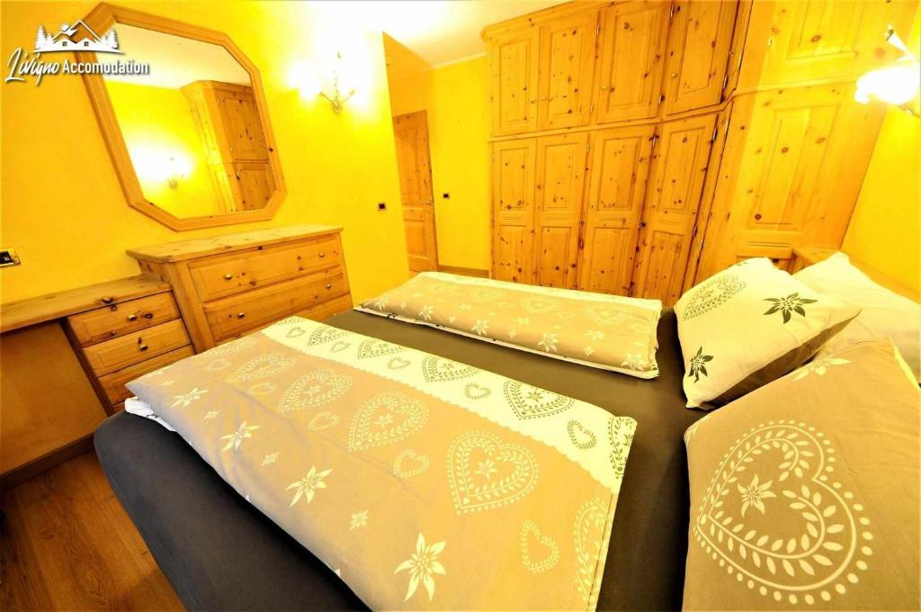 Posteľ alebo postele v izbe v ubytovaní Alpen Royal by Livigno Accomodation