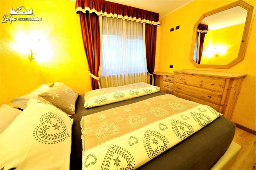 Posteľ alebo postele v izbe v ubytovaní Alpen Royal by Livigno Accomodation