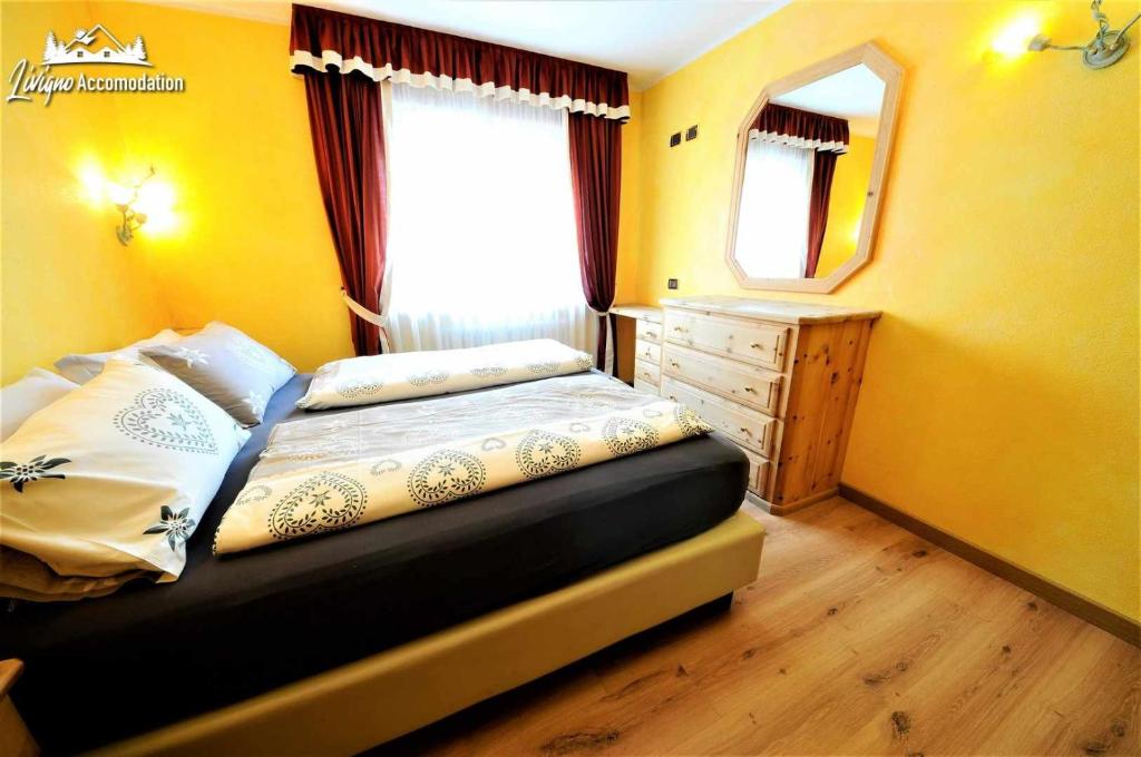 Posteľ alebo postele v izbe v ubytovaní Alpen Royal by Livigno Accomodation