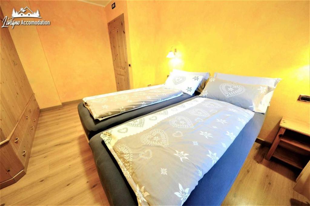 Posteľ alebo postele v izbe v ubytovaní Alpen Royal by Livigno Accomodation