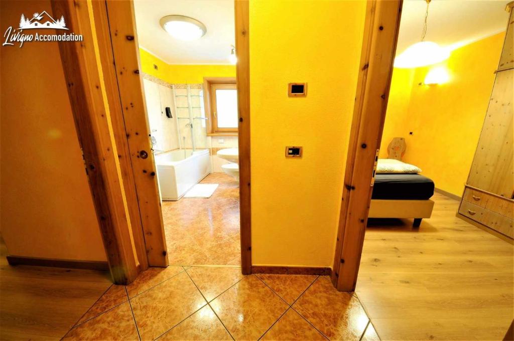 Posteľ alebo postele v izbe v ubytovaní Alpen Royal by Livigno Accomodation