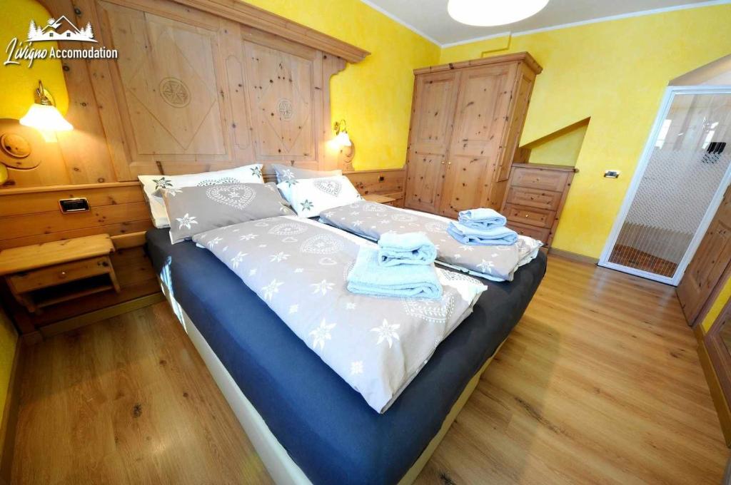 Posteľ alebo postele v izbe v ubytovaní Alpen Royal by Livigno Accomodation