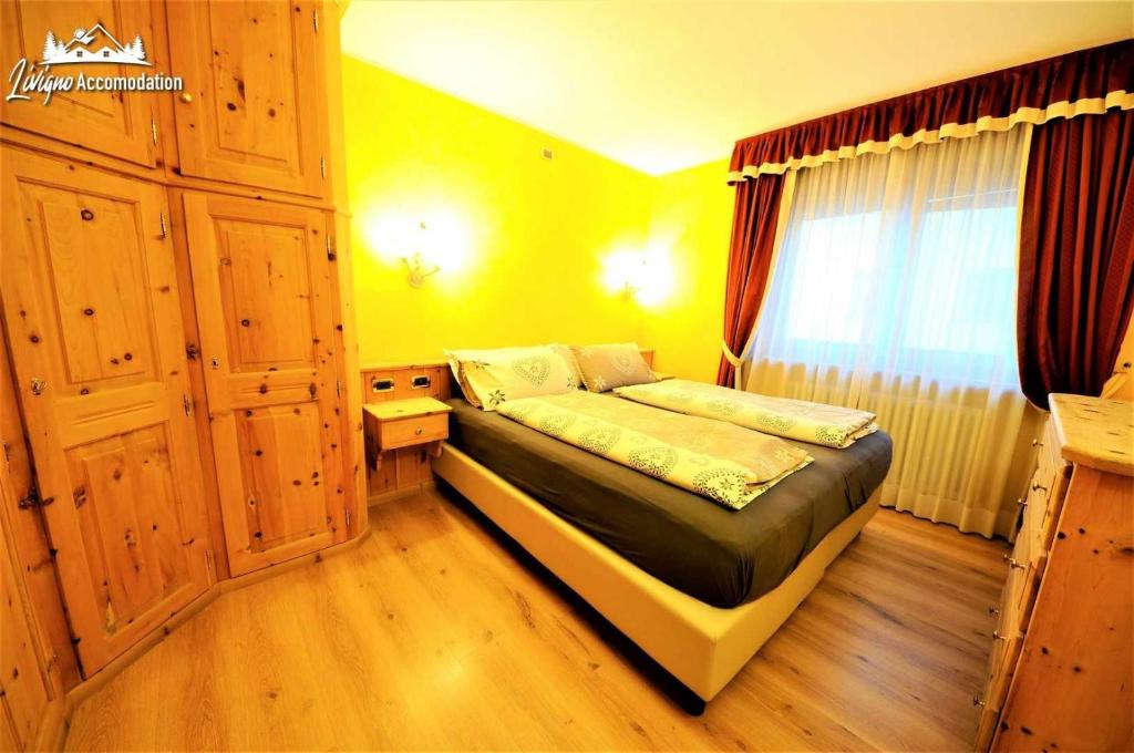 Posteľ alebo postele v izbe v ubytovaní Alpen Royal by Livigno Accomodation