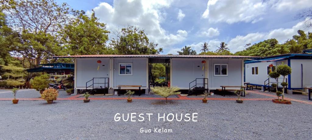 a guest house withjust house written in front of it at Guest House Gua Kelam in Kaki Bukit