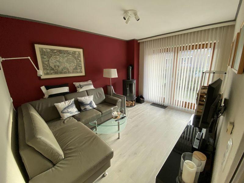 a living room with a couch and a glass table at Ferienwohnung-Starkwind in Lemkenhafen auf Fehmarn