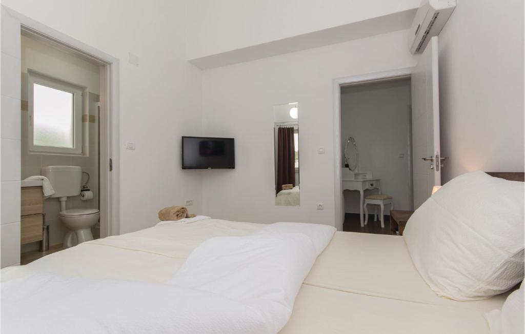 Łóżko lub łóżka w pokoju w obiekcie Holiday Home Marcana 57