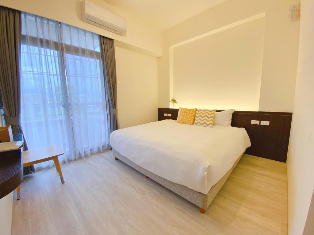 Posteľ alebo postele v izbe v ubytovaní 這好宅