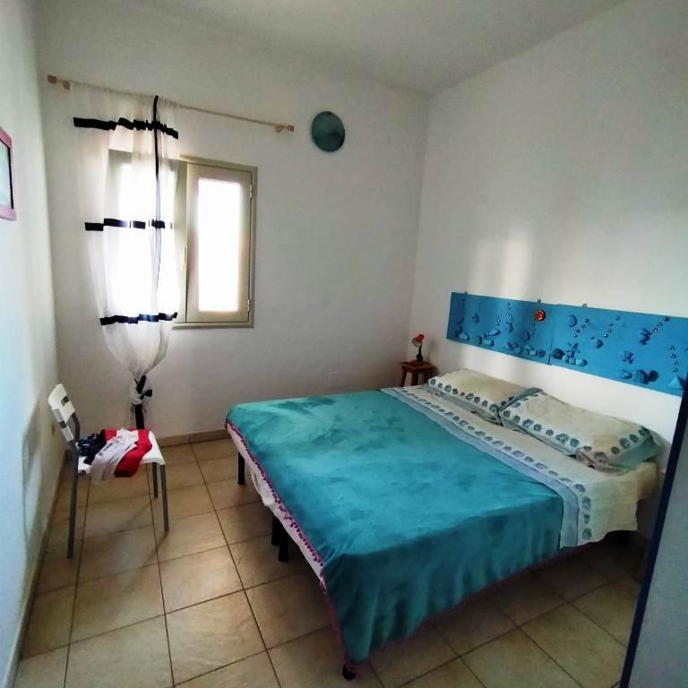 Postel nebo postele na pokoji v ubytování Residence Giglio