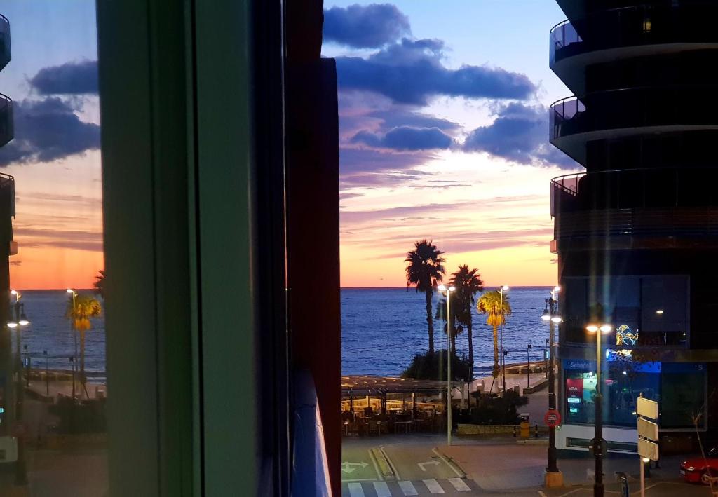 a view of the ocean from a window of a building at By the beach in Calpe