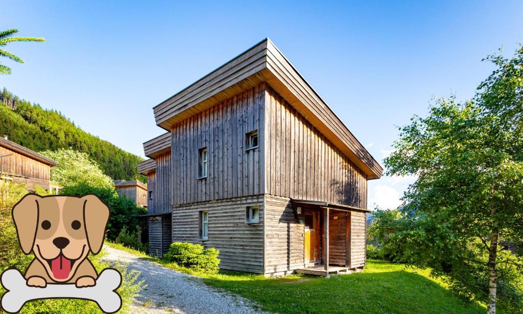 rysunek psa siedzącego przed domem w obiekcie Chalet Sternwarte w mieście Hohentauern