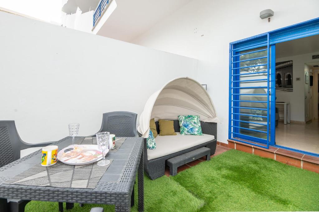 a living room with a couch and a table at MODERN APARTMENT NEXT TO THE BEACH, Pets friendly in Benalmádena