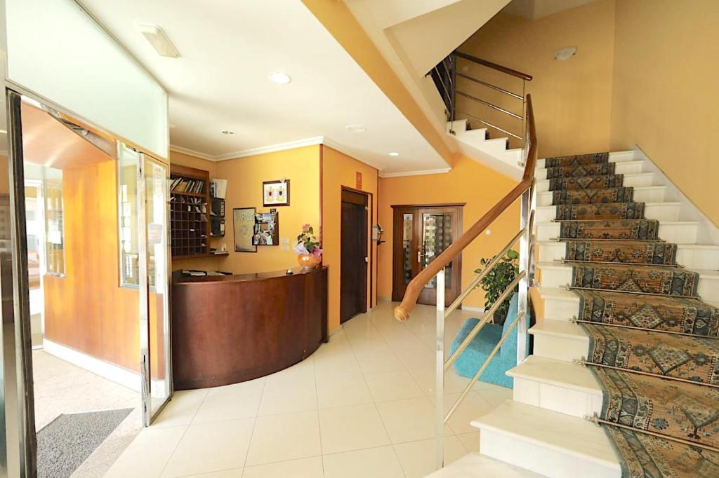 a hallway with a staircase in a house at Hotel Paraíso Del Marisco in O Grove