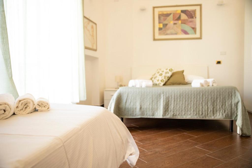 A bed or beds in a room at Palazzo de Brado