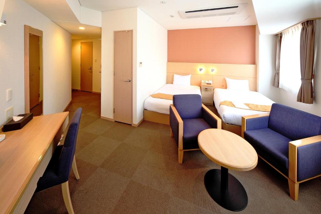 Postel nebo postele na pokoji v ubytování Hotel Sunplaza Osaka Sakai Annex