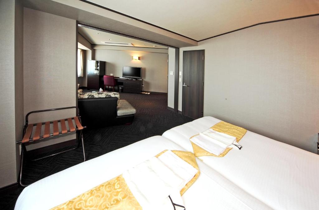 Postel nebo postele na pokoji v ubytování Hotel Sunplaza Osaka Sakai Annex