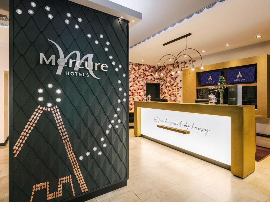 a store with a sign for a m appliance motel at Mercure Wien Zentrum in Vienna