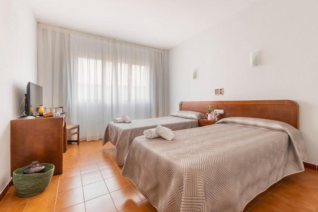Cama o camas de una habitación en Hotel Sierra de Arcos