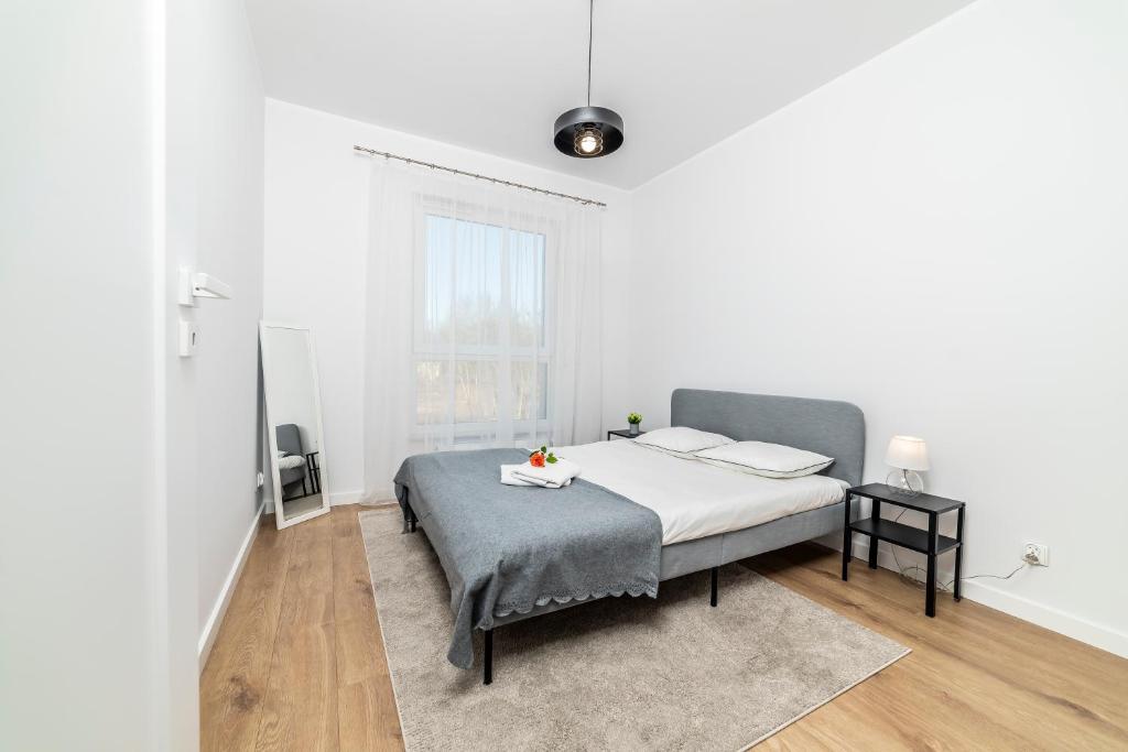 Llit o llits en una habitació de Apartamenty Przy IV Śluzie - LUX 50m2