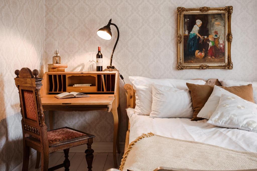 Postel nebo postele na pokoji v ubytování Grand Hotel Lysekil