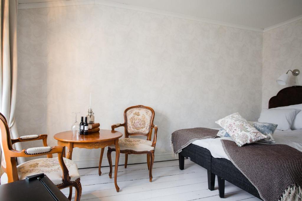 Postel nebo postele na pokoji v ubytování Grand Hotel Lysekil