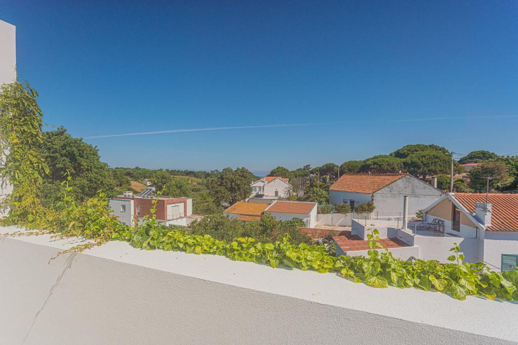 a view of a city from the roof of a building at Melro's Places in Sesimbra