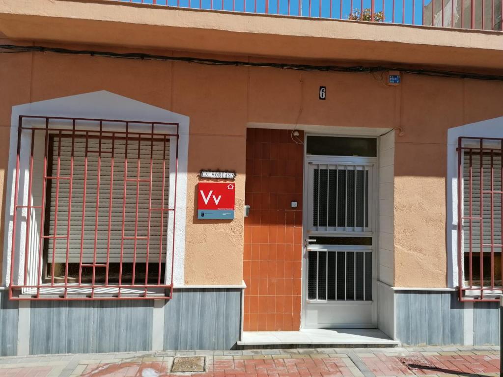 a building with a gate and a door at LA SORIANA in Águilas