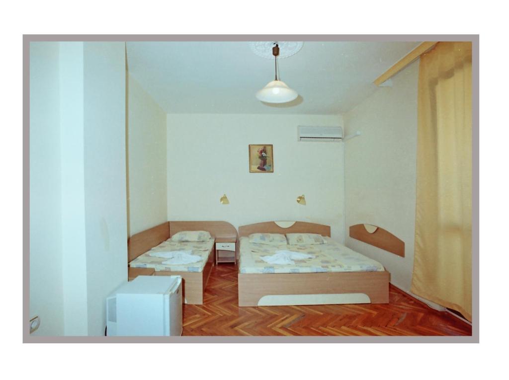Postel nebo postele na pokoji v ubytování Hotel Apart