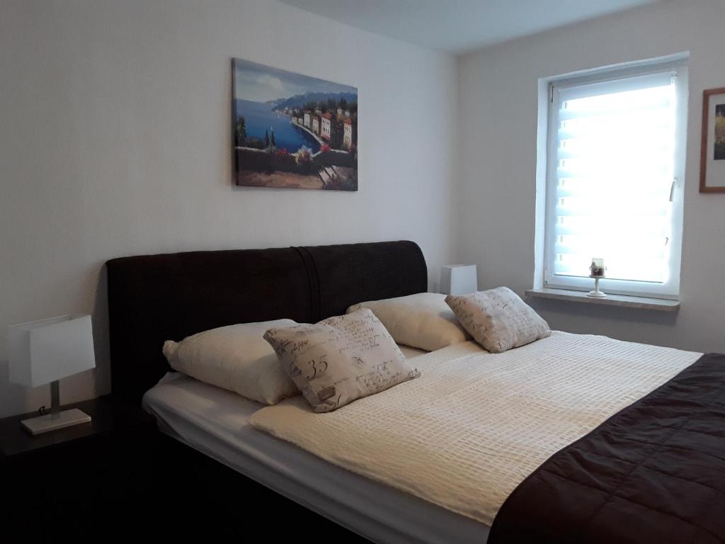 Postel nebo postele na pokoji v ubytování Ferienwohnung Weiland