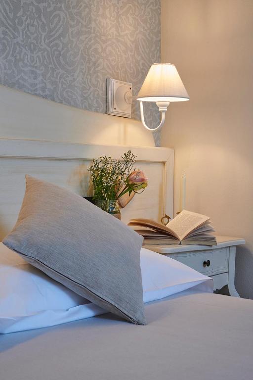 Łóżko lub łóżka w pokoju w obiekcie Hotel Villa Aurora