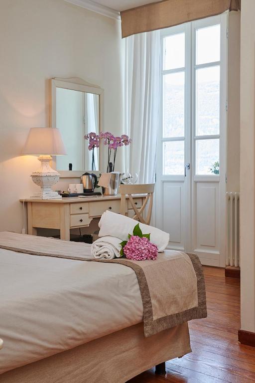 Łóżko lub łóżka w pokoju w obiekcie Hotel Villa Aurora