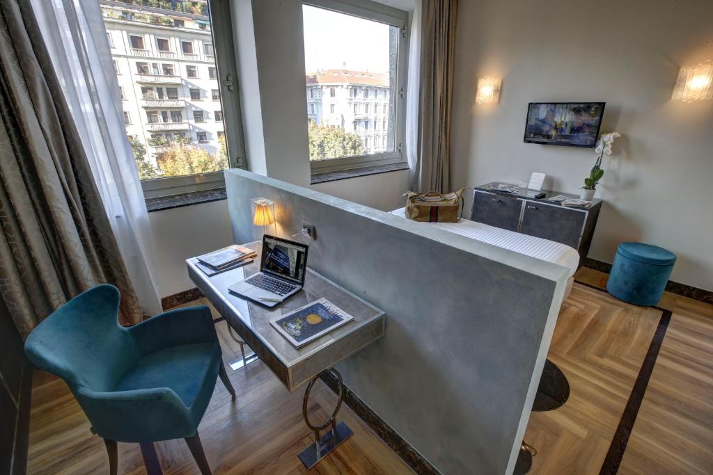 TV a/nebo společenská místnost v ubytování Bianca Maria Palace Hotel