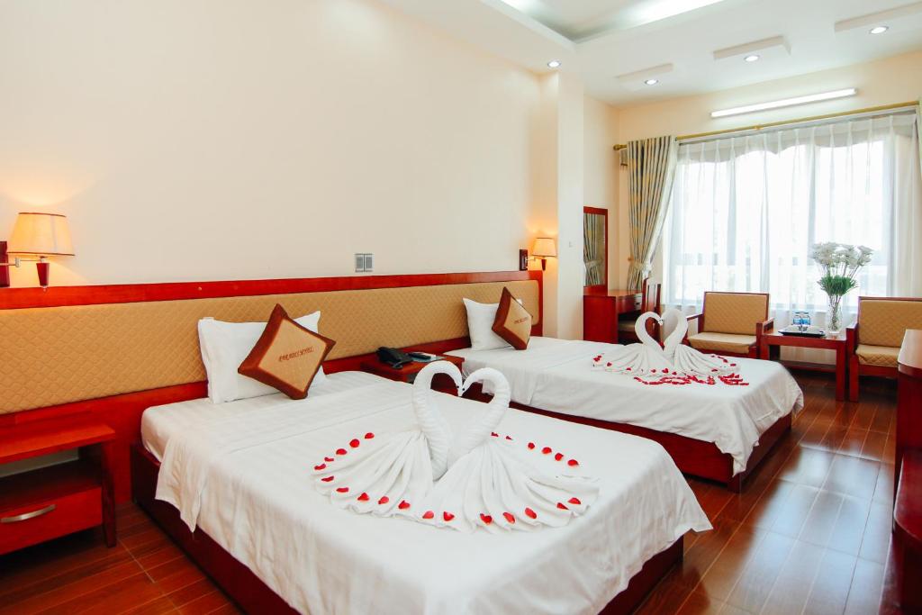 Postel nebo postele na pokoji v ubytování Paradis Hotel