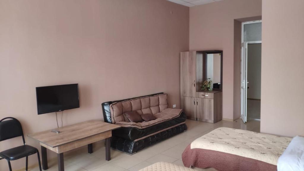 TV a/nebo společenská místnost v ubytování Ideal