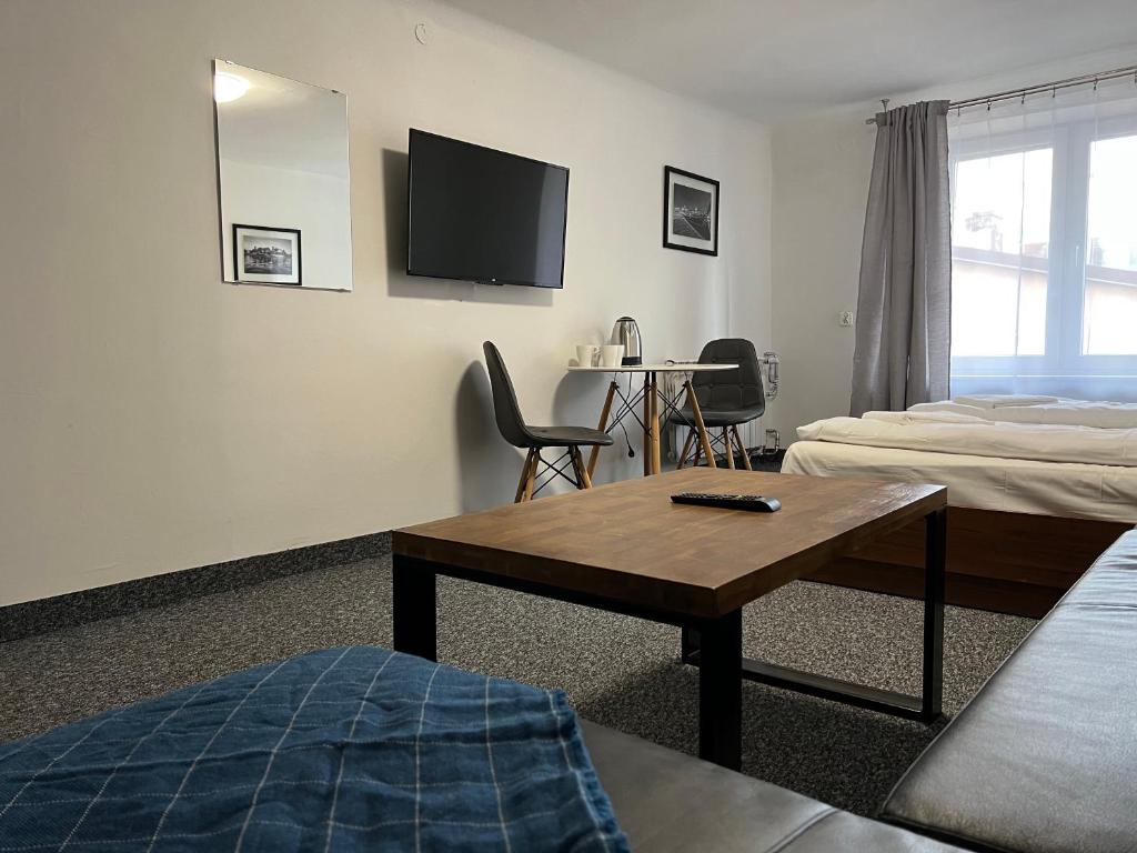 TV a/nebo společenská místnost v ubytování Garbarska 22 Aparthotel