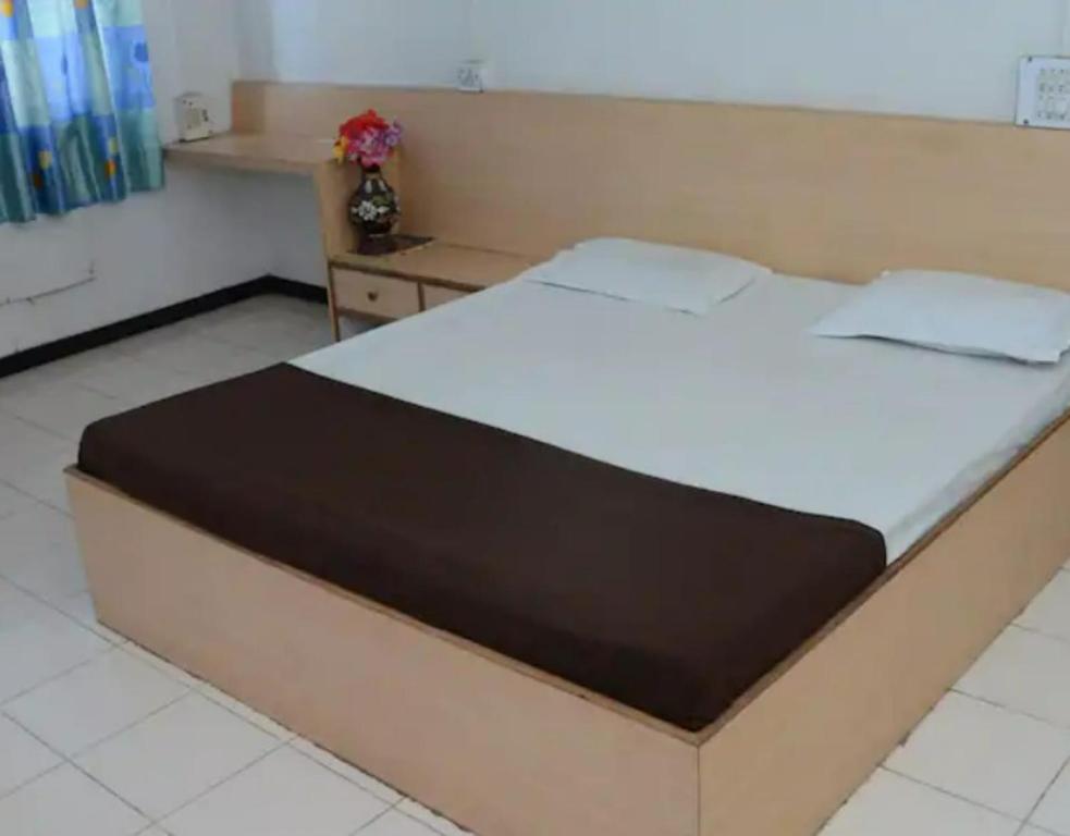 Postel nebo postele na pokoji v ubytování Hotel Rahi